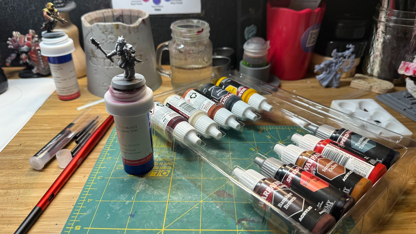 A photo of the Army Painter Masterclass paints with a model