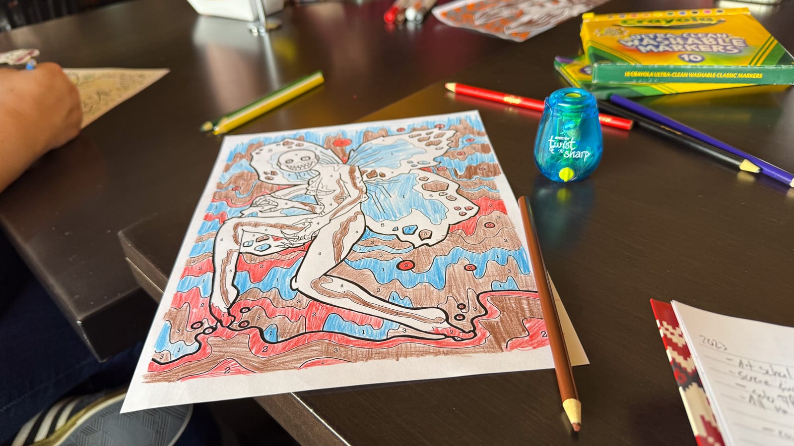 A photo of a coloring book page for Forgery