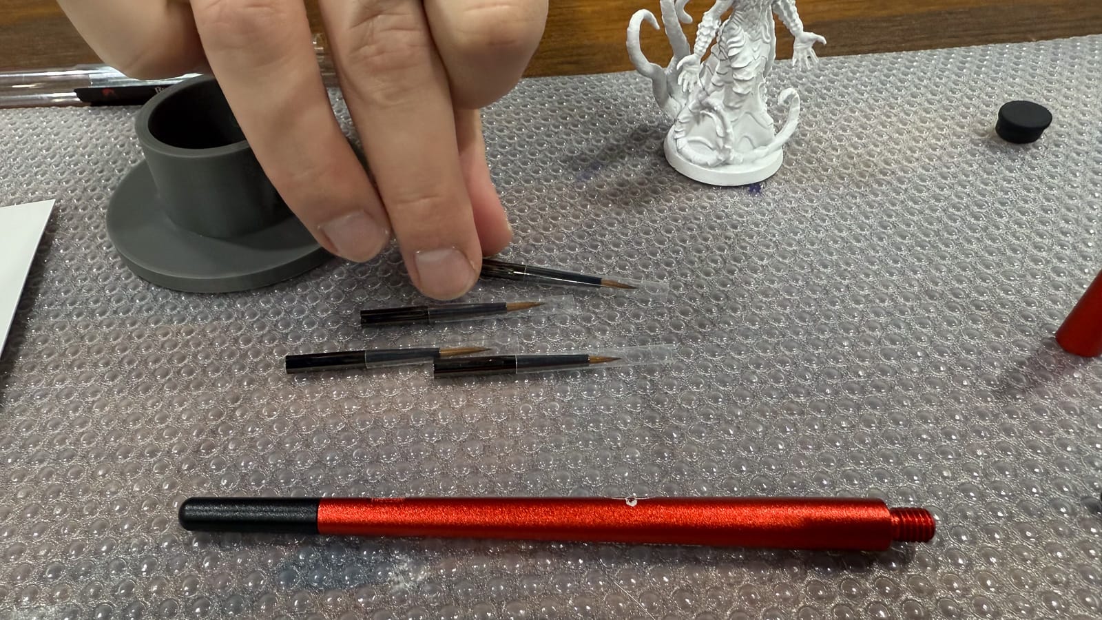 A photo of the Lethal Shadows Paint Scythe and brush heads