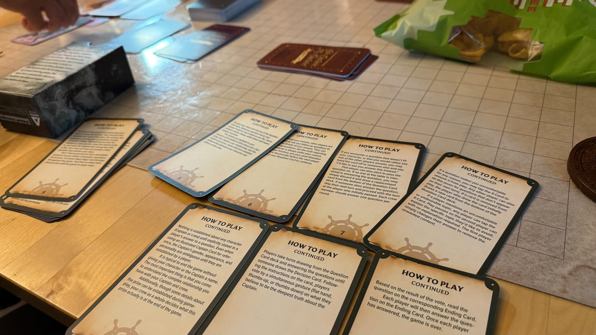 A photo of the rule cards for Oh Captain My Captain