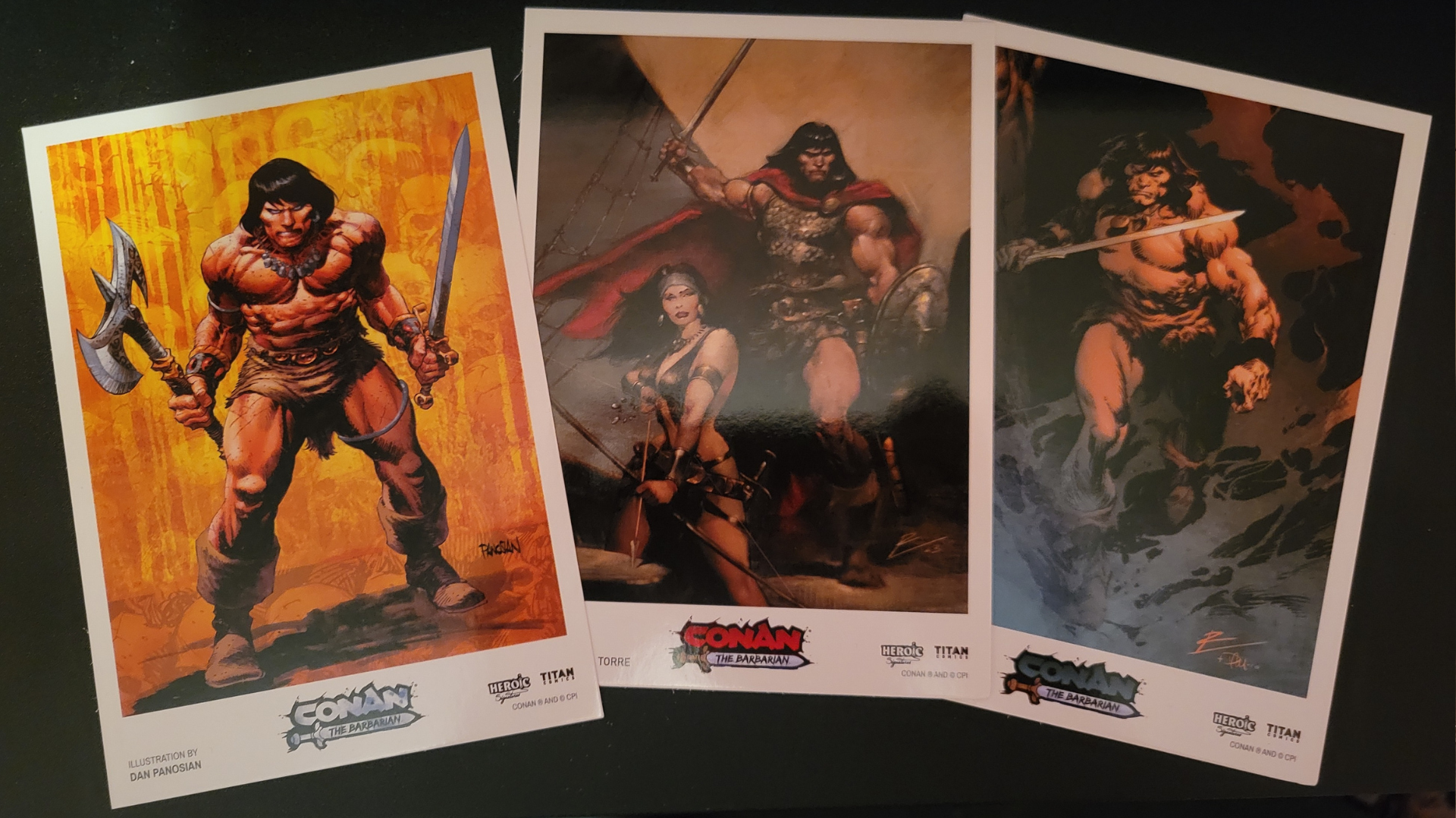 Art cards showcasing the cover art of each volume of Conan the Barbarian included in the box set