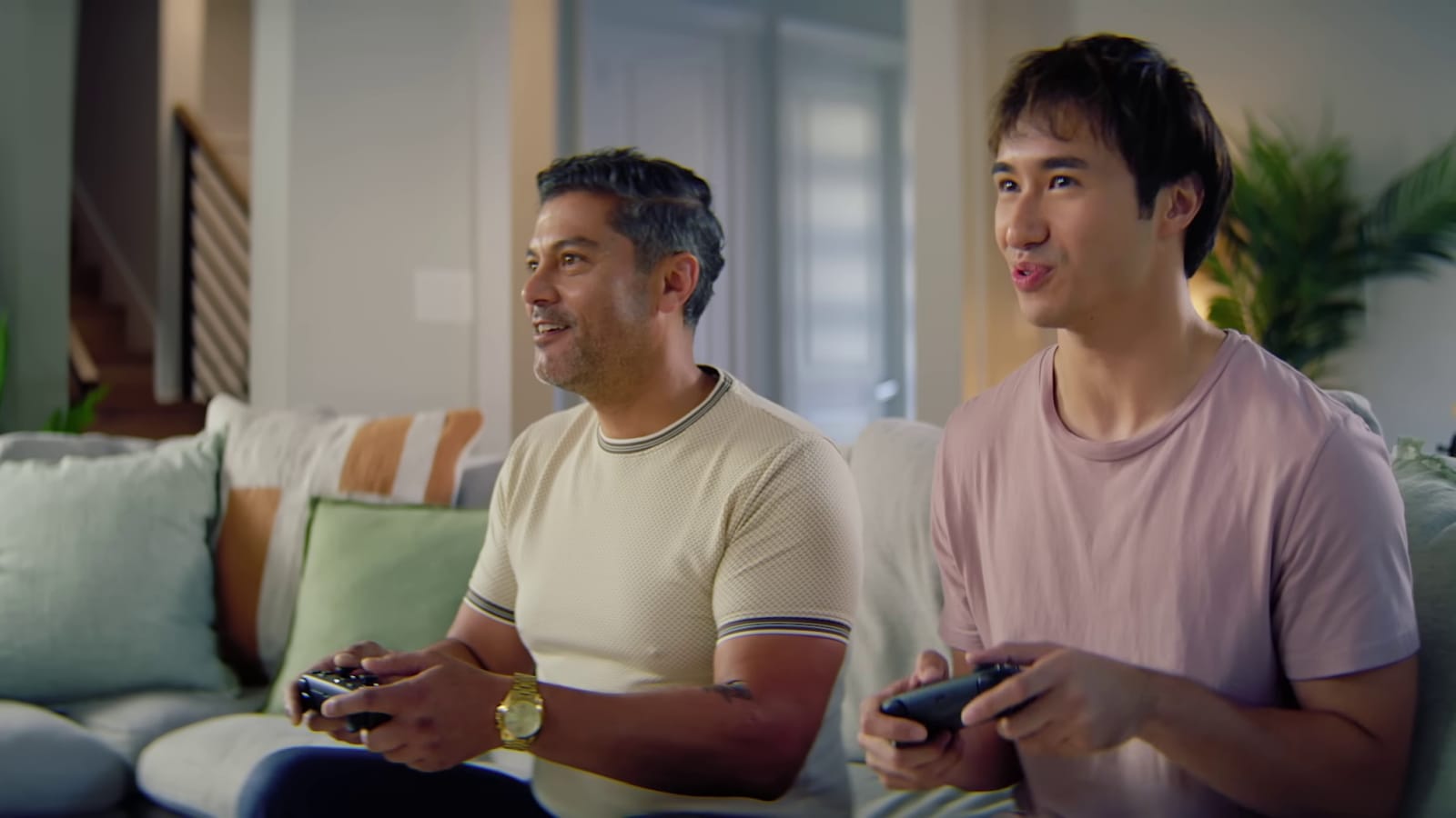 Two people playing Steam games using the Steam Controller