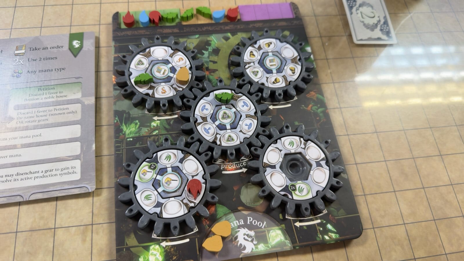 Media res of the Kobolds' gear board. with 8 mana exhausted, 4 stored in gears, and 2 in the active pool. All gears are enchanted, and all but one have a seal.