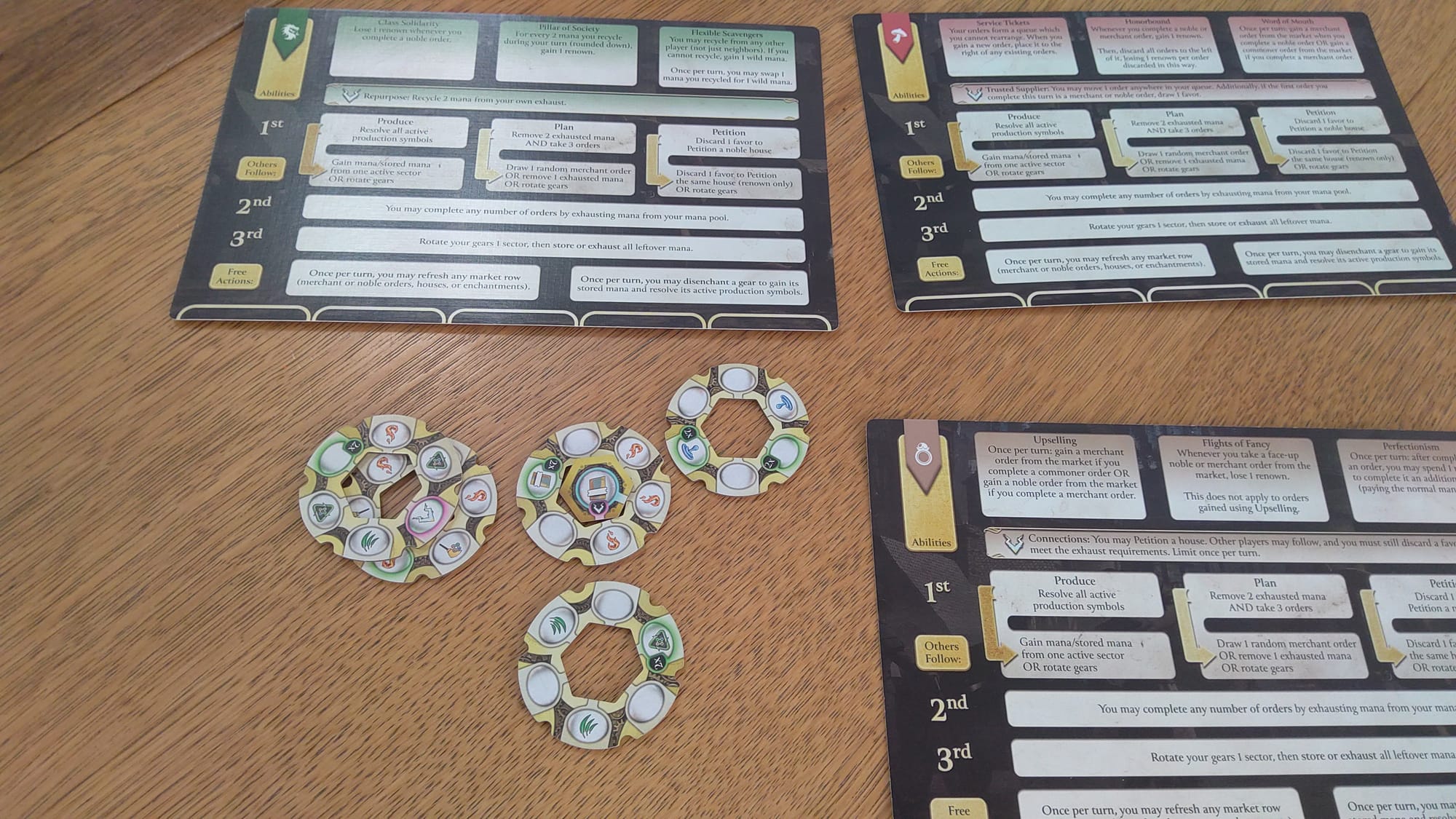 Three of the advanced faction boards, reforged enchantments on the bottom left.