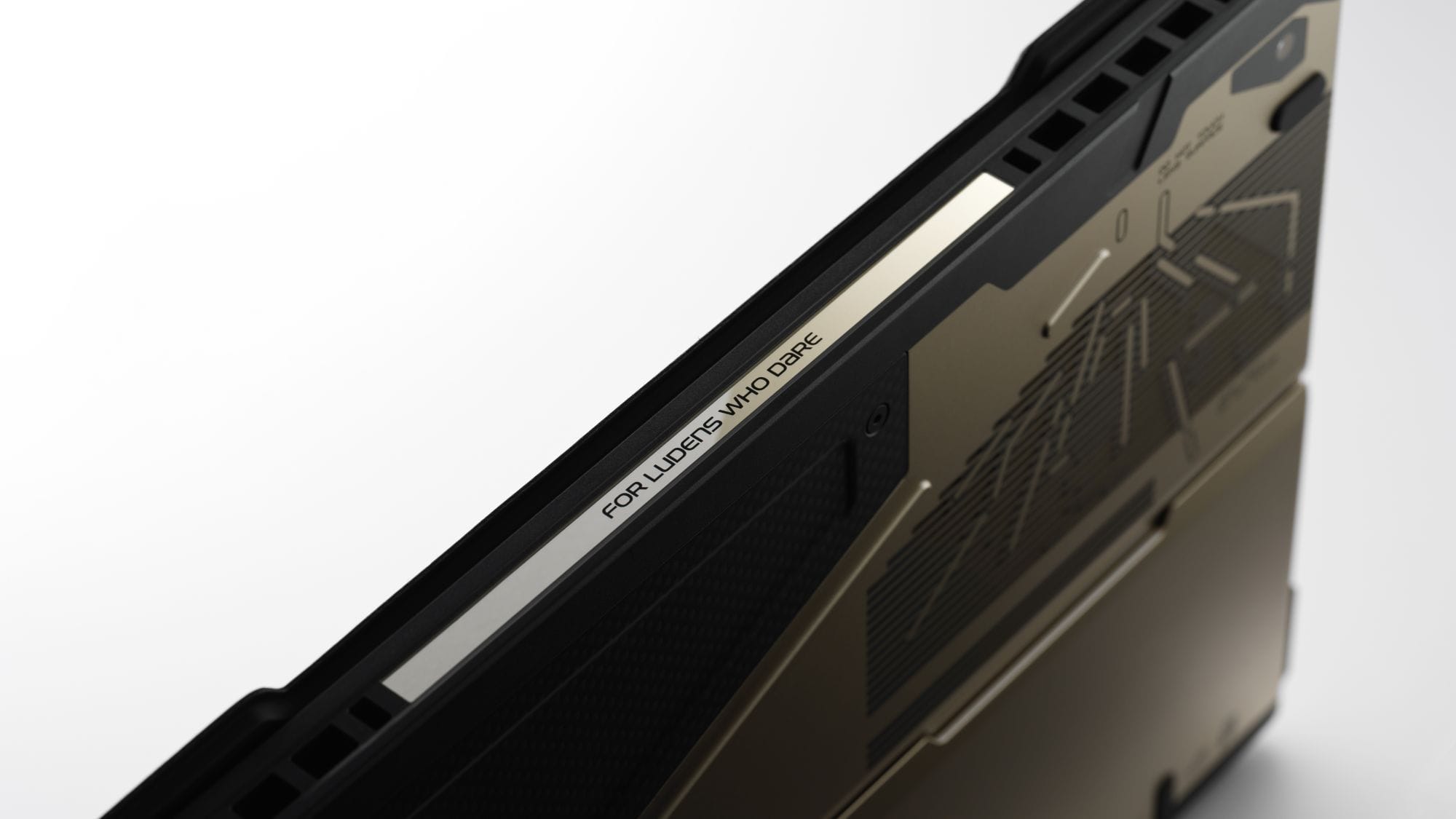 An inscription on the laptop that says "For Ludens who dare".