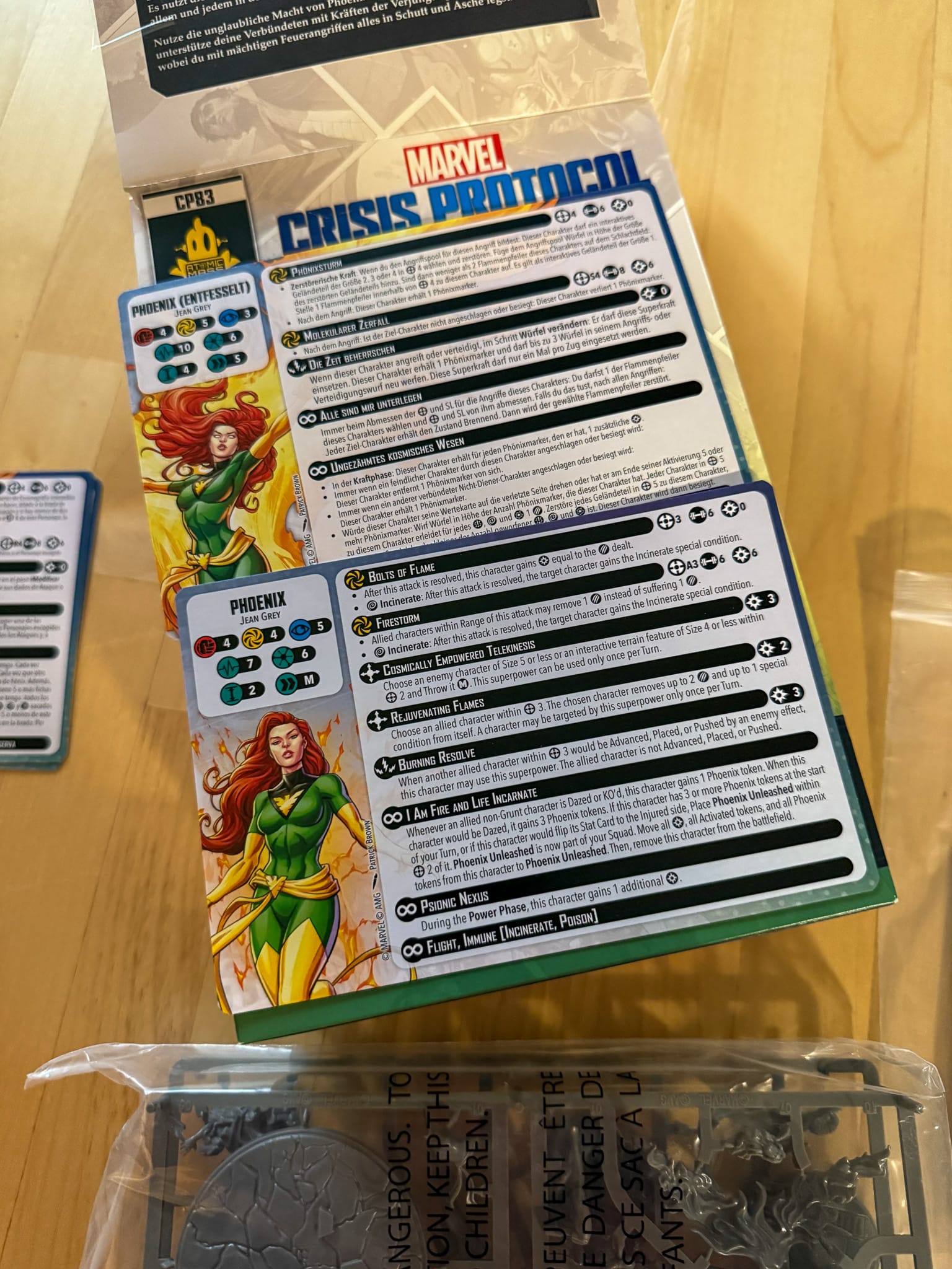 A photo of the character cards for Marvel Crisis Protocol Phoenix