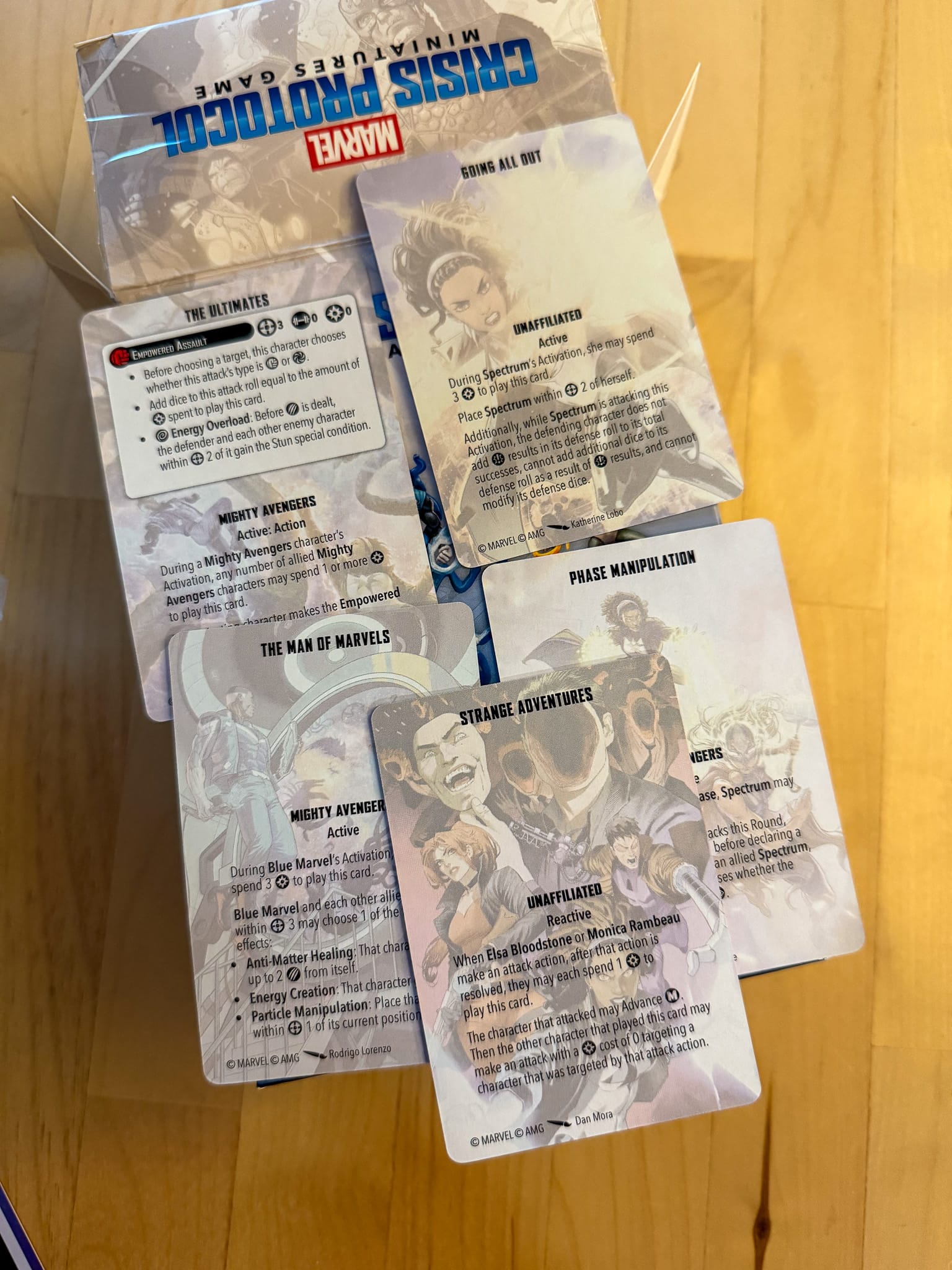 A photo of Marvel Crisis Protocol Blue Marvel and Spectrum team tactic cards