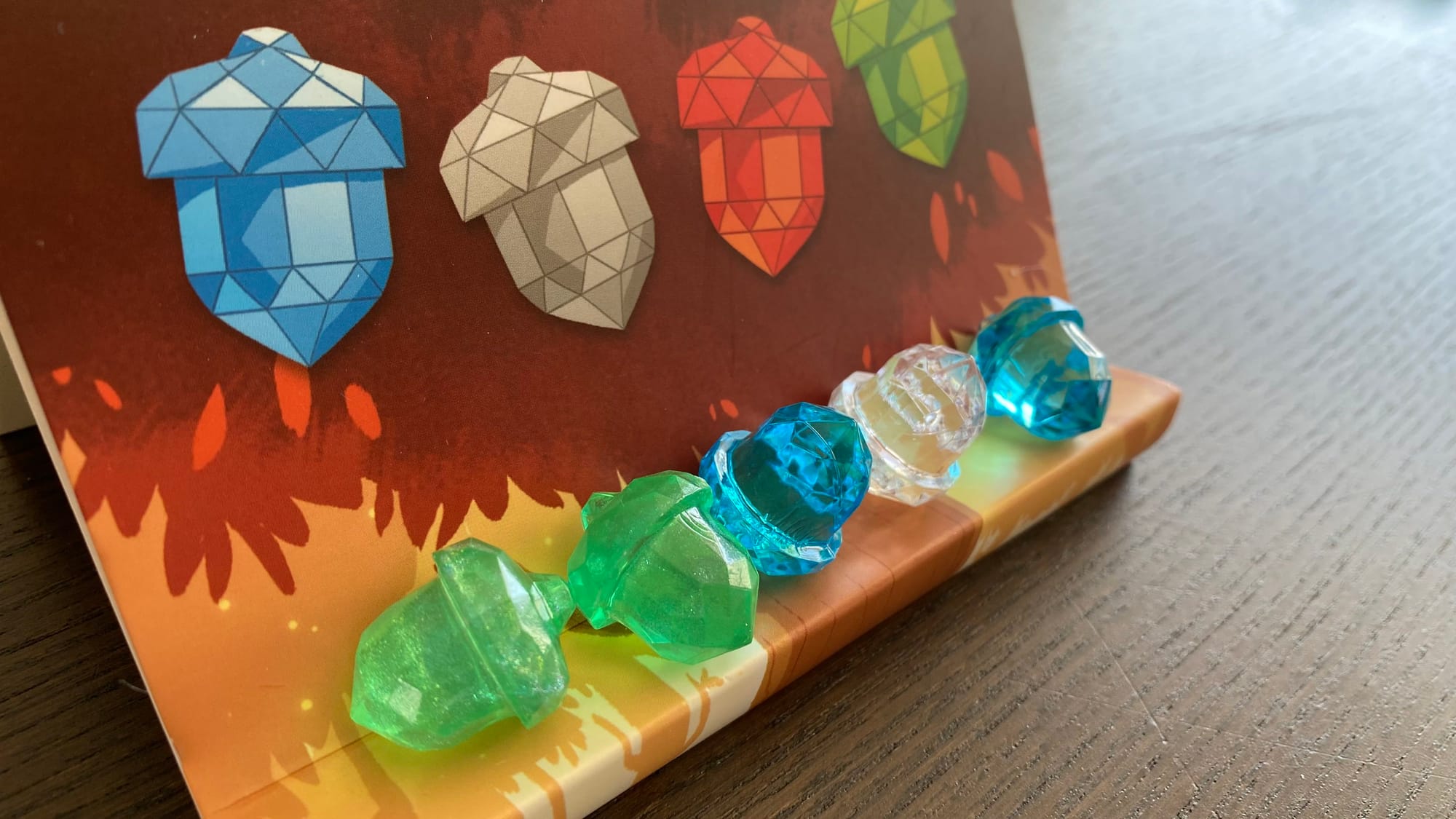 A player screen displaying the player's collected acorns, which has all colors except red