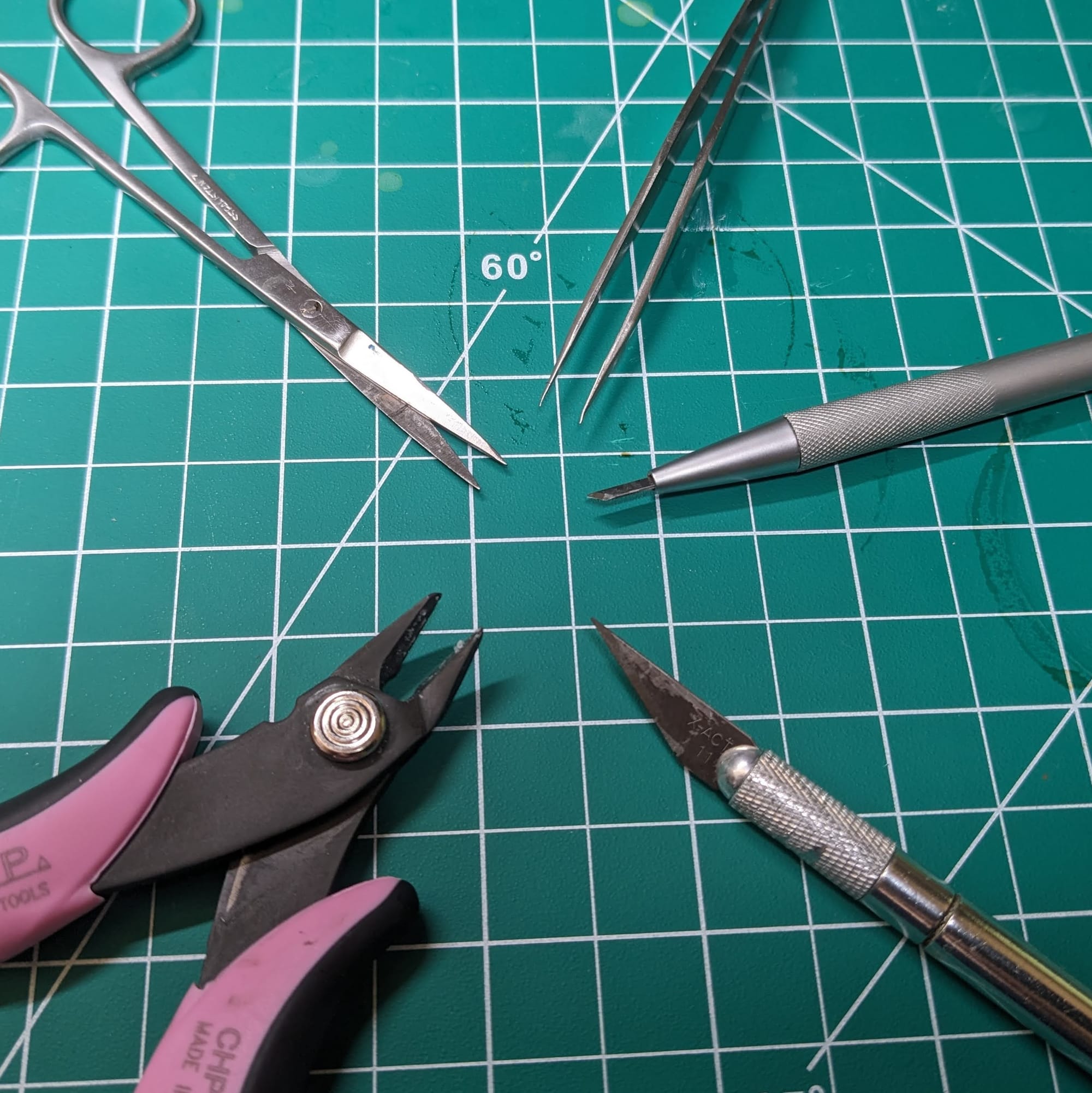 Clippers, tweezers, X-Acto blades, scissors
