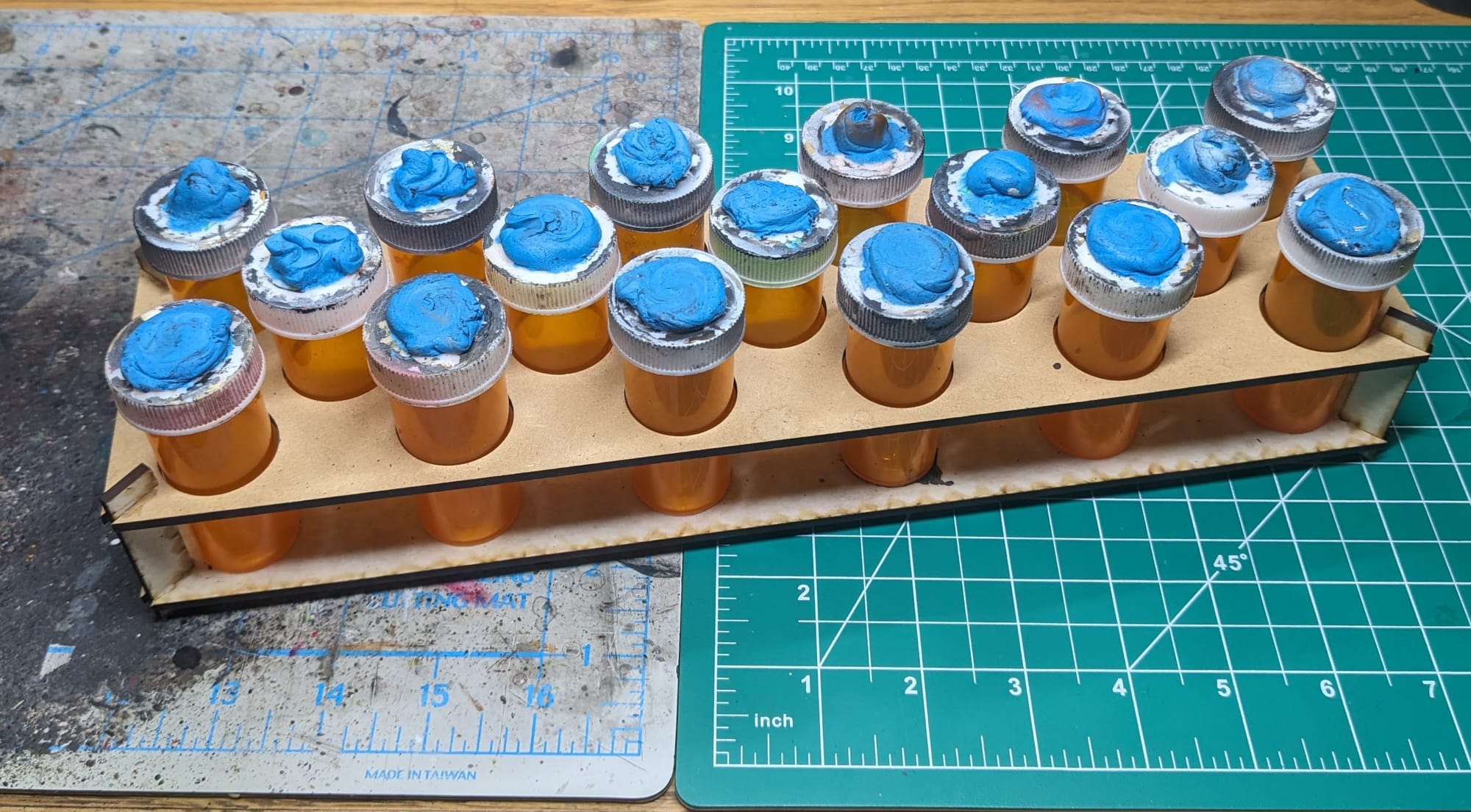 Model Holder use medicine tubes and poster tac