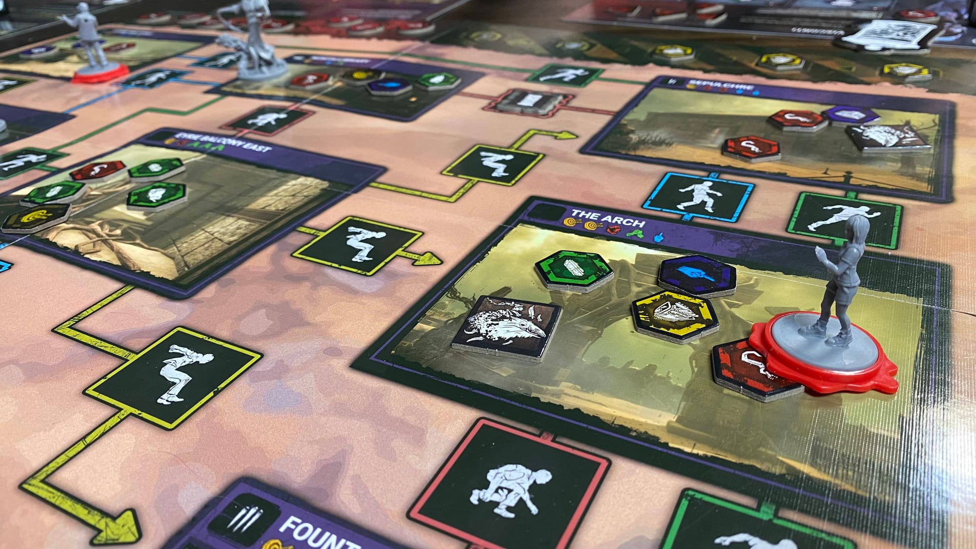 The Artist hunts down other Survivors in the Forsaken Boneyard while one of her Dire Crows watches over a hooked Survivor