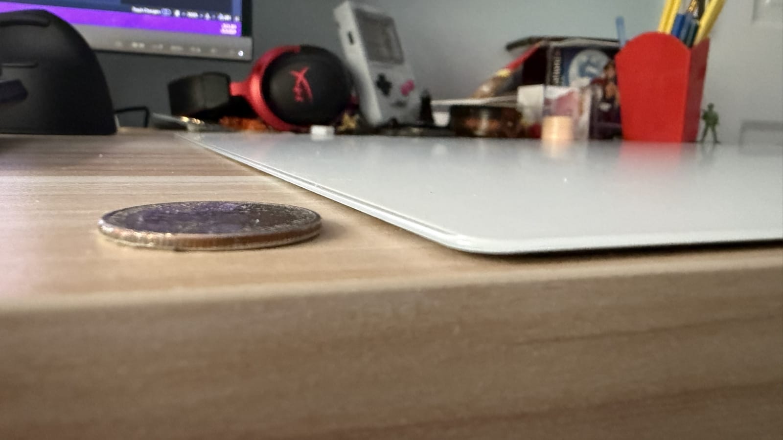 The Atlas Pro as compared to a quarter.