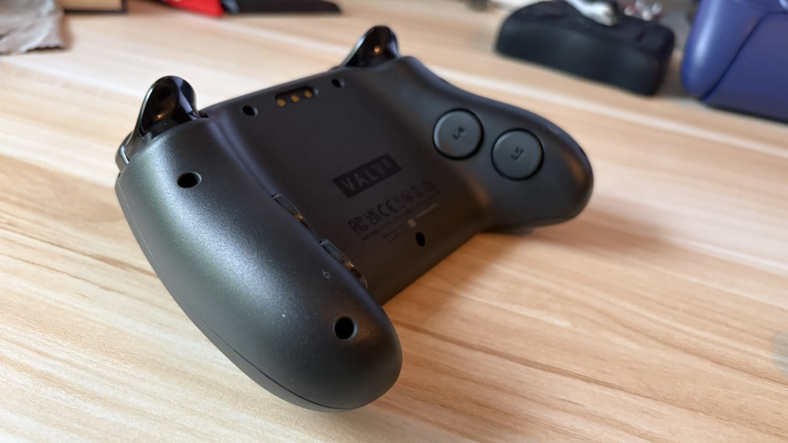 The Steam Controller from the side.