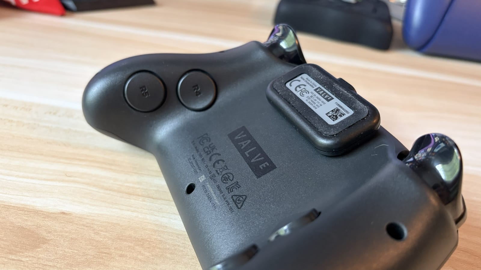 The Steam Controller from the side, with the puck attached.