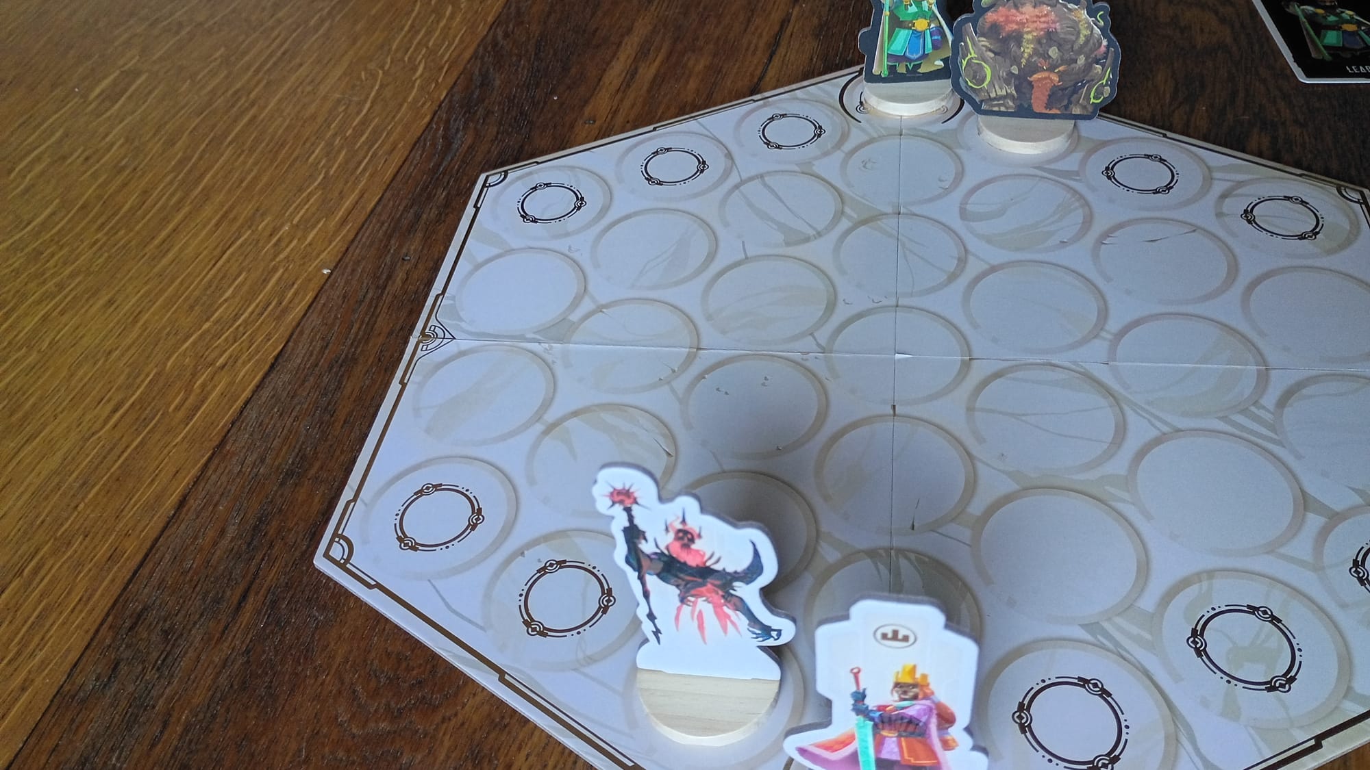 The board, with a couple characters on it in example starting locations