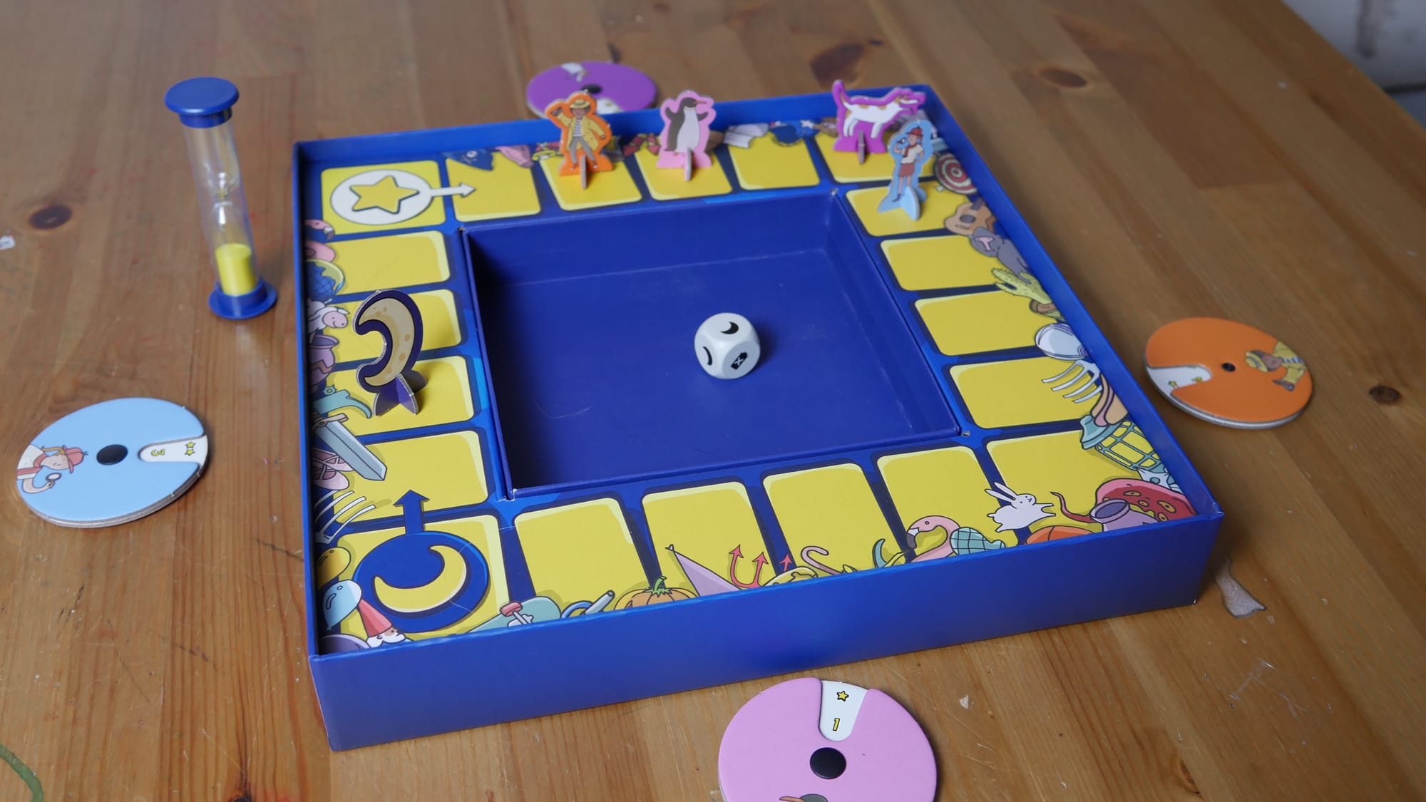 A picture of the game box that has a board and dice tray built in.