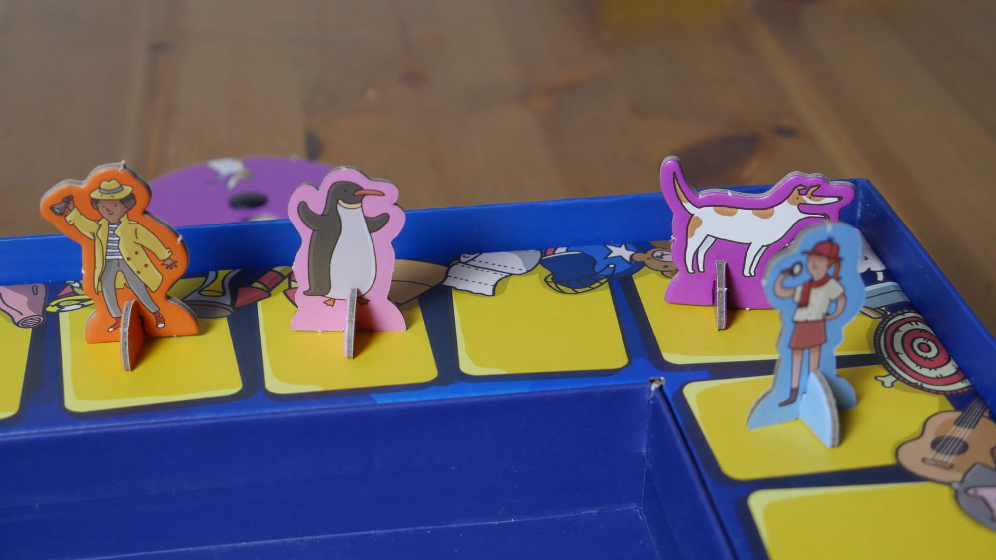 A close up of the player standees showing off the fun artwork.