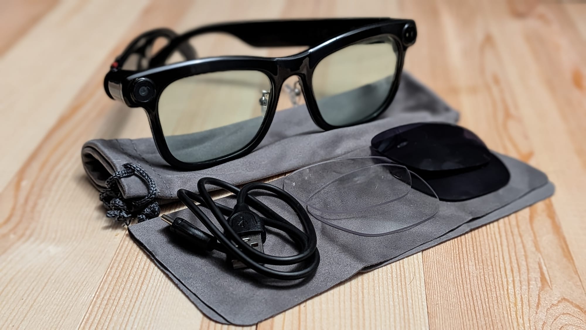 The glasses come with two spare sets of lenses, a carrying case, USB-C cable to charge with, and a microfiber cloth.