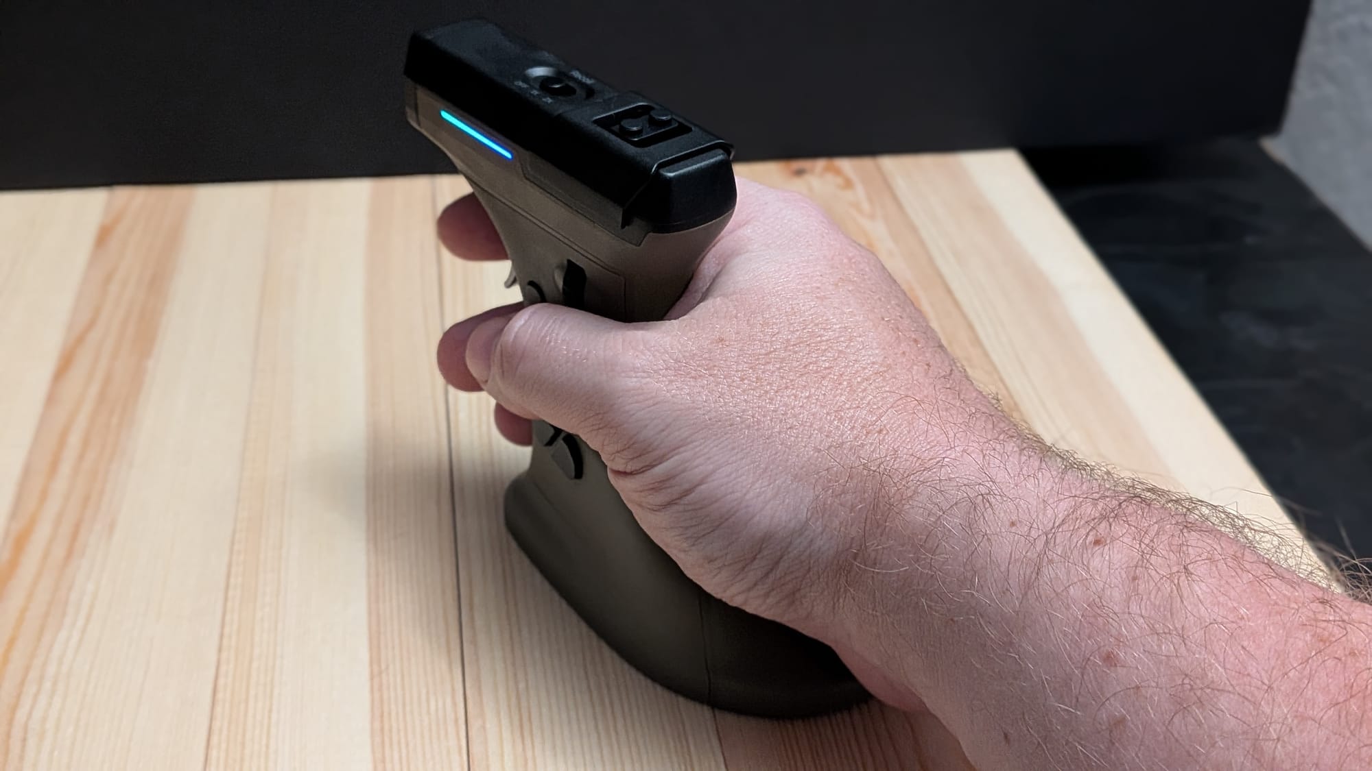 Fits comfortably, even in big hands, though the arm and shoulder may tire out