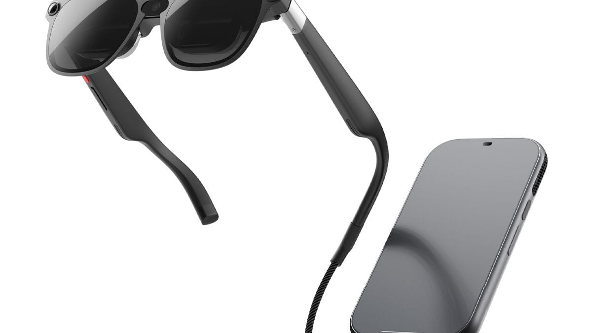 XREAL AURA glasses connected by a braided USB-C cable to the compact compute puck