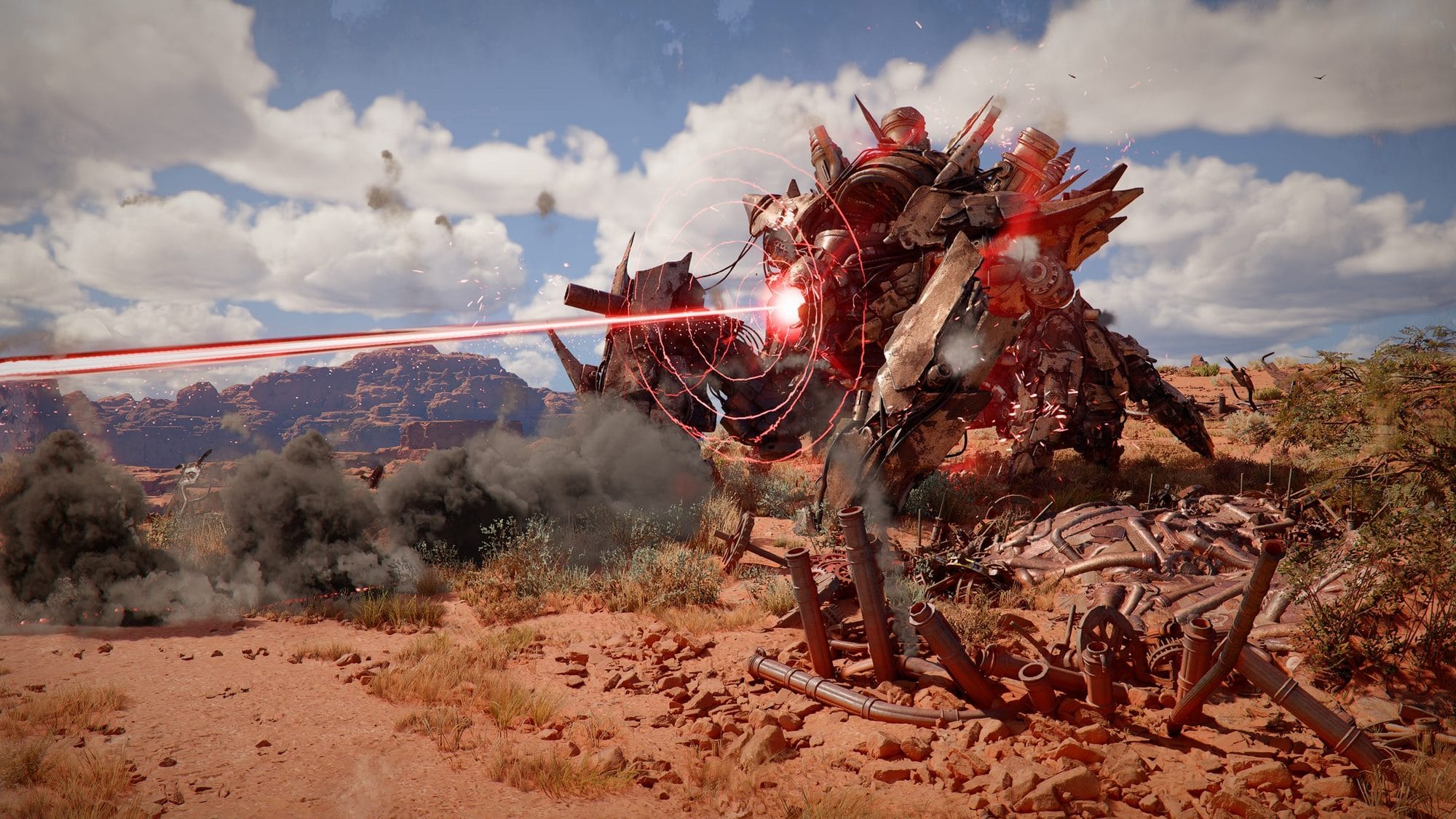 Towering red-glowing mechanical beast firing a laser across a desert beside wrecked machinery