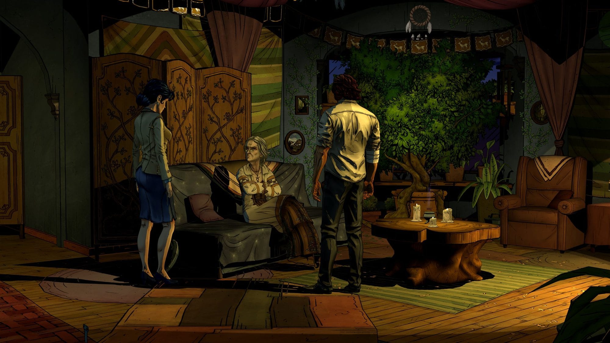 Bigby and Snow White stand before an older woman on a couch in a green, candle-lit room