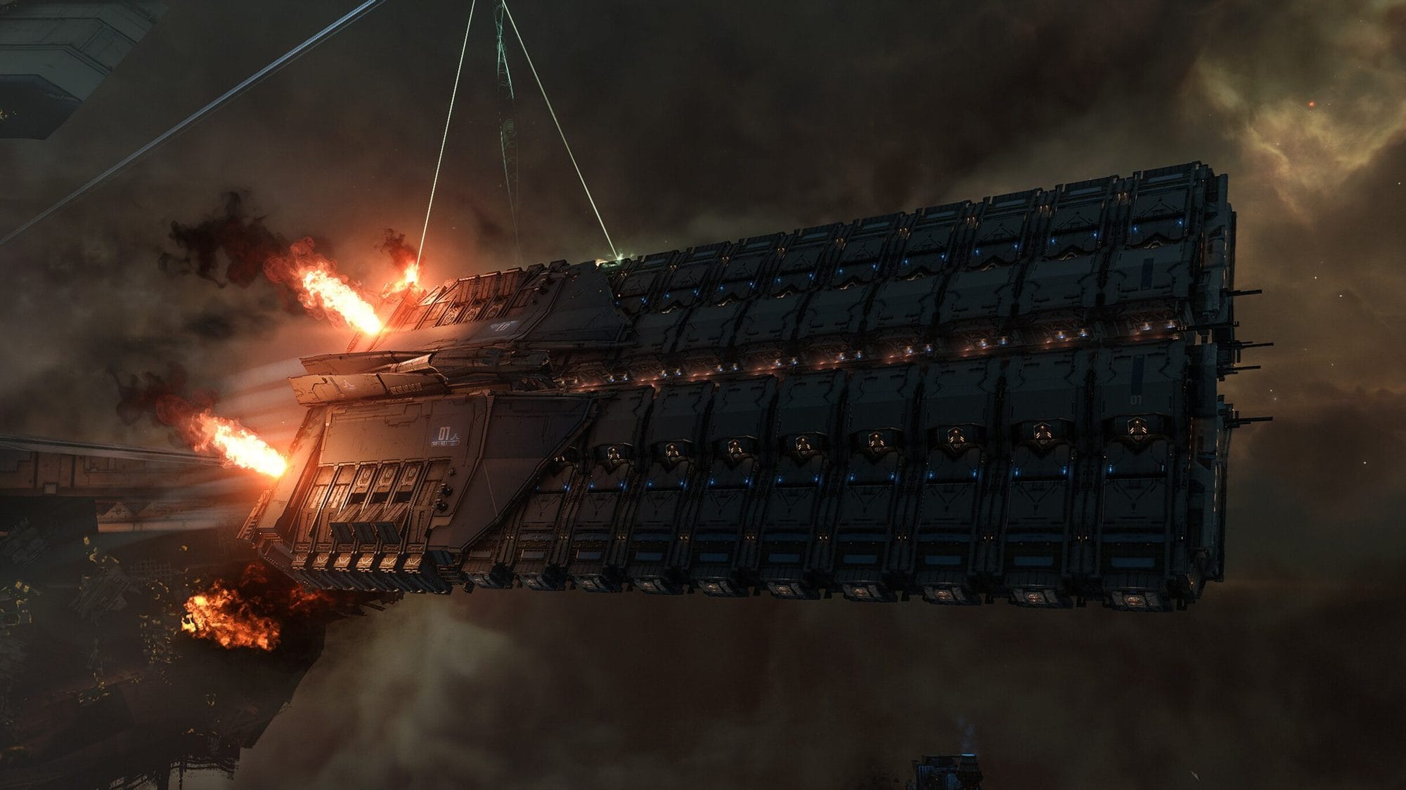 Burning capital ship held by tractor beams alongside a large hangar structure