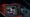 The logos of Akupara, Pixeljam, and Behold on a CRT.