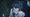 An anime cutscene of the protagonist in rain