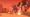 Player character dashing past a giant tentacled fungus-robot boss firing a beam under a red sky in Mycopunk