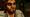 Close-up of Bigby Wolf glaring with glowing yellow eyes in The Wolf Among Us Remastered