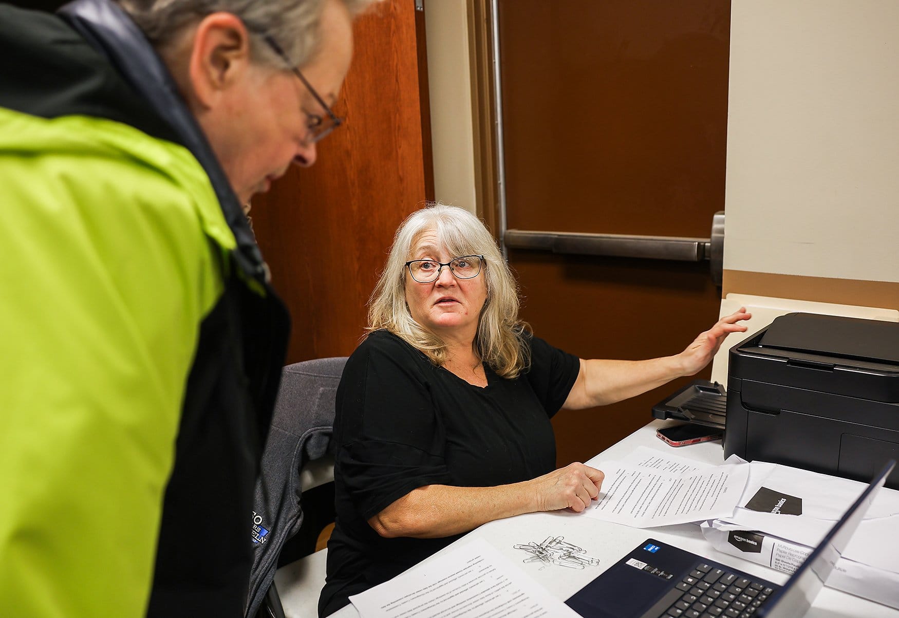 Brenda Buechele collects and makes a copy of residents’ signed affidavits on Wednesday, April 1, 2026, at the Montgomery