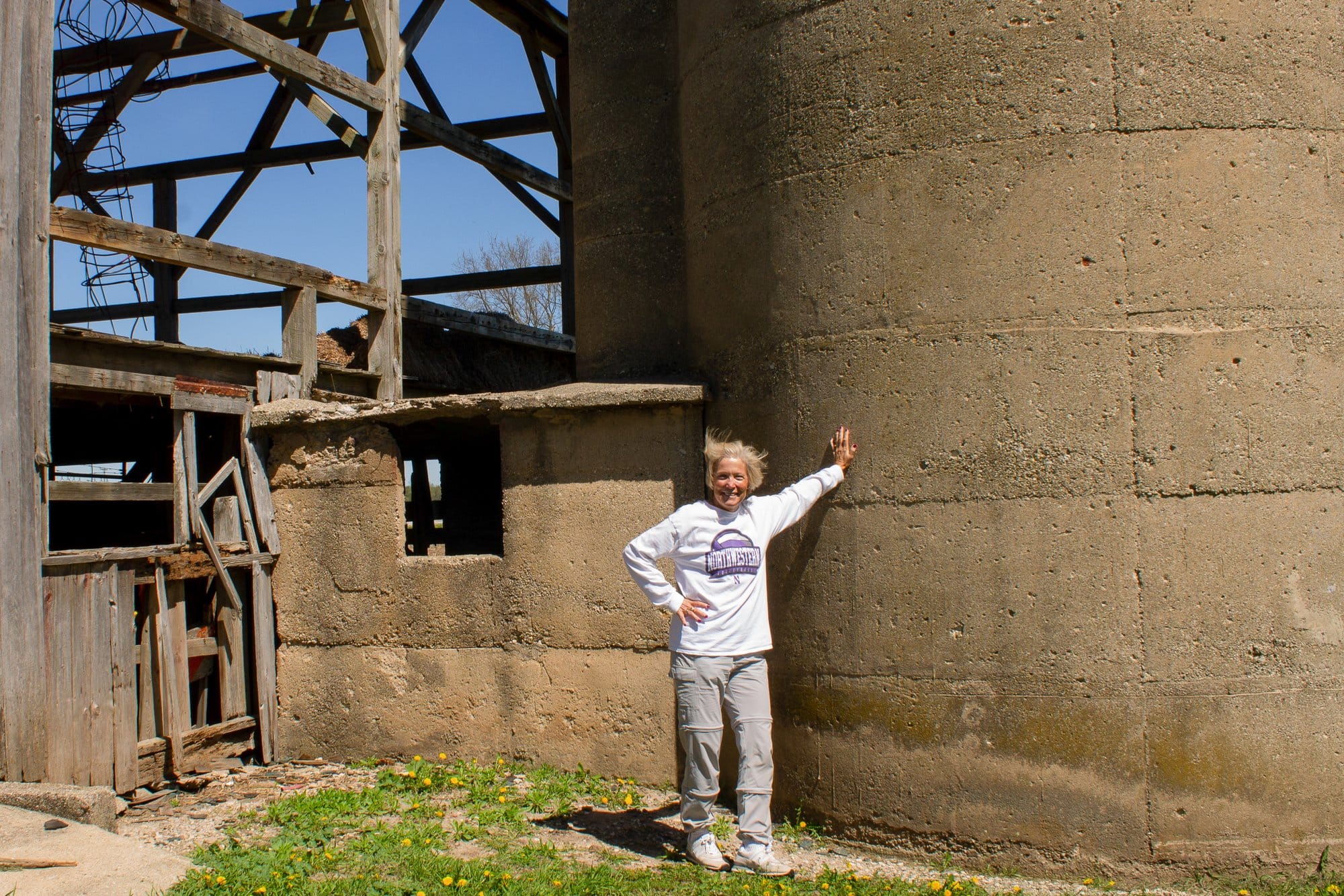 Marianne May poses at one of Frank May’s silos in Johnsburg, Ill.