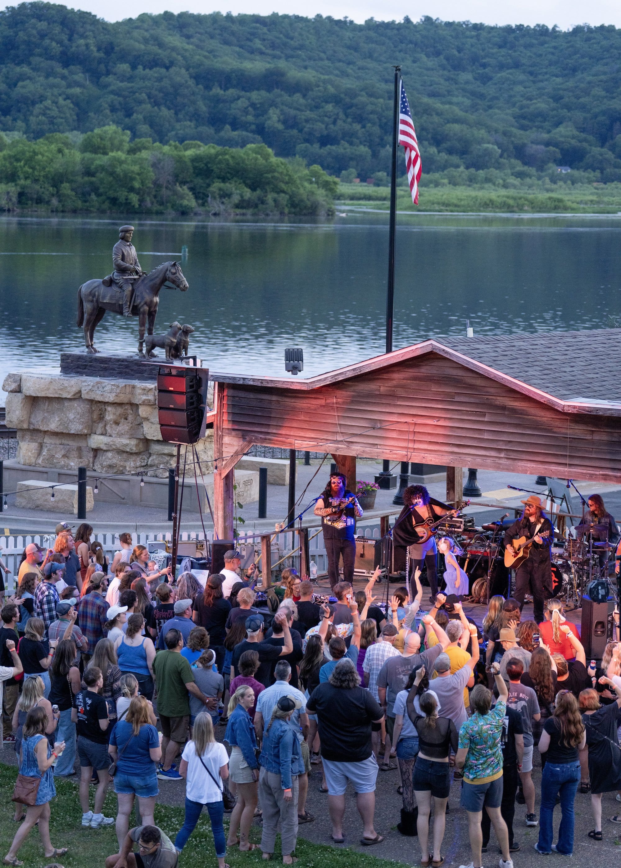 People cheer during a concert by Them Coulee Boys Friday, May 29, 2026, at the Trempealeau Hotel in Trempealeau, Wisconsin.