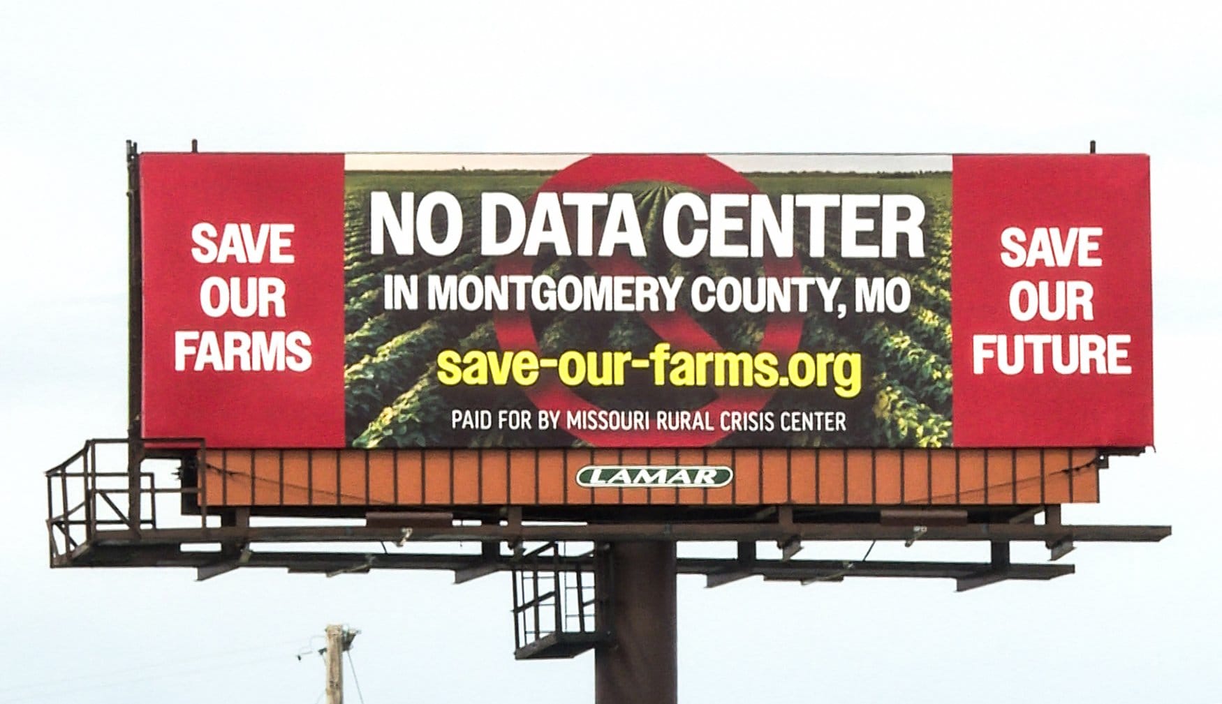 A billboard calling for opposition to data center development stands on April 23, 2026, on I-70 near High Hill, Missouri.