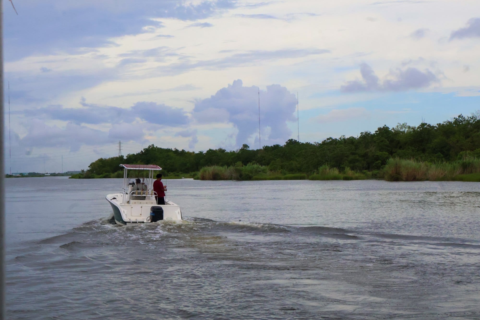 Boaters fish in the canals and wetlands just outside of New Orleans, Louisiana.