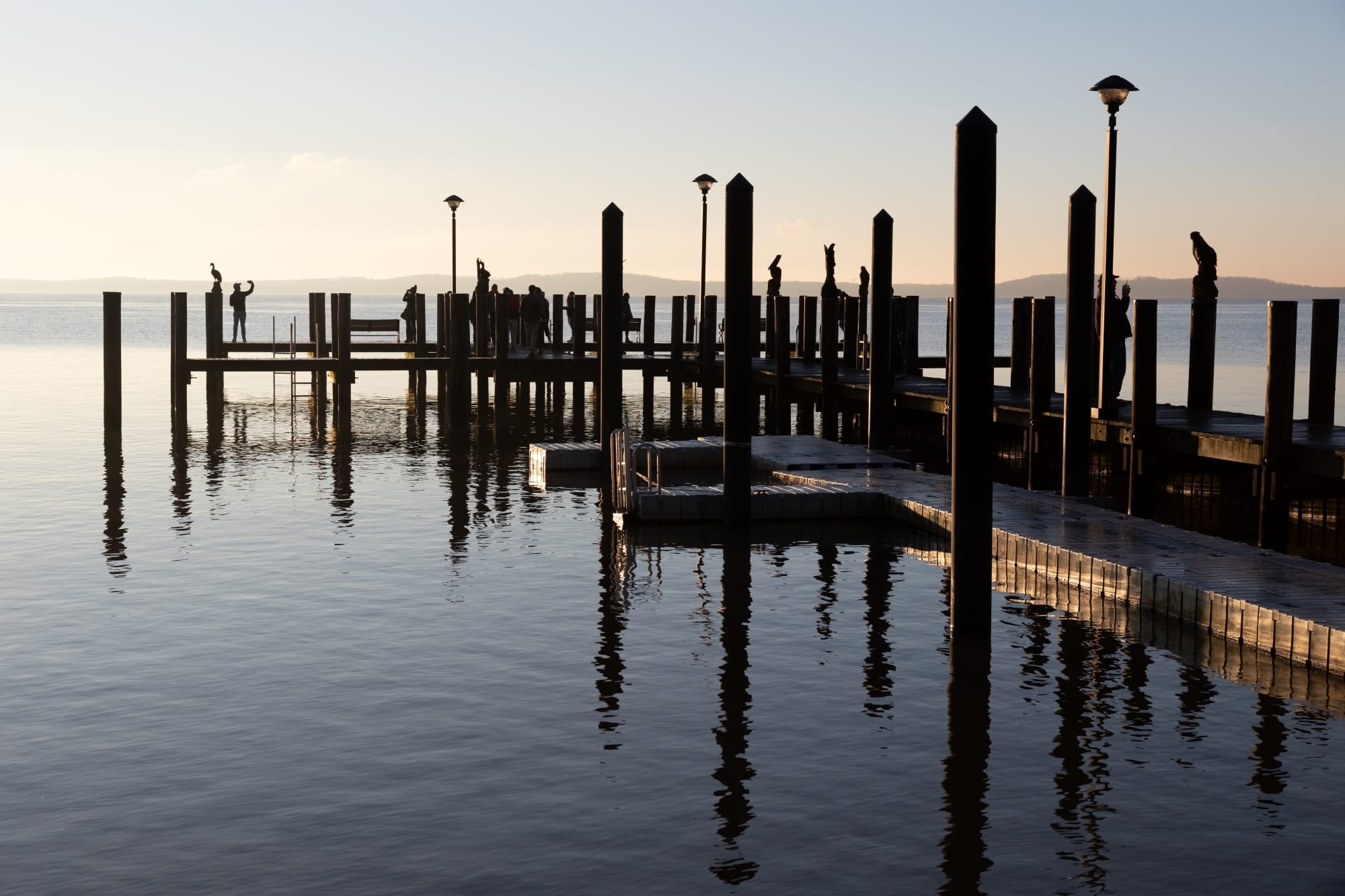 The sun rises over a dock on Chesapeake Bay 