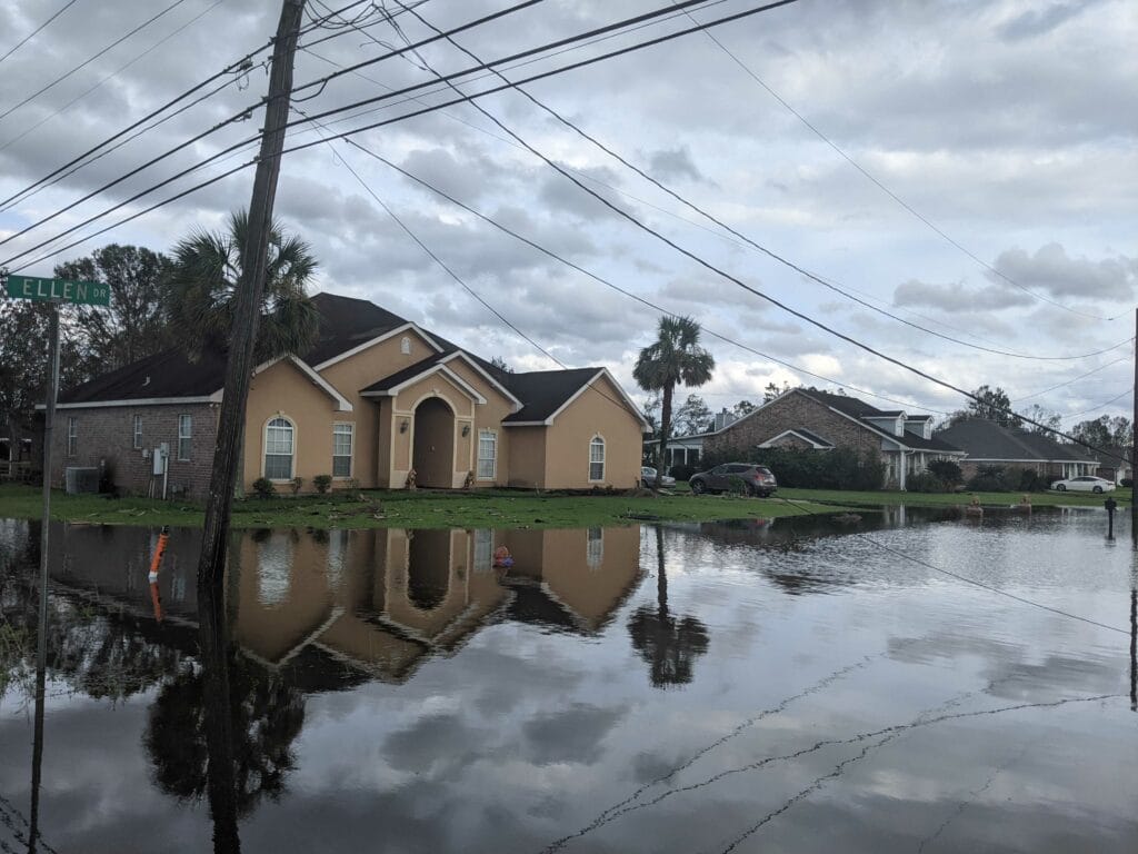 Street in front of a residential area is flooded following Hurricane Ida.