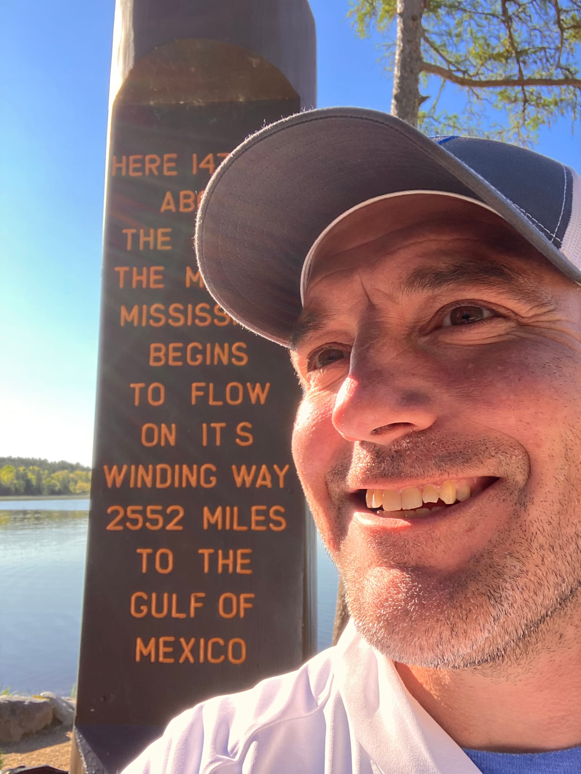 Shawn Hammerlink takes a selfie in front of the Headwaters Monument. 