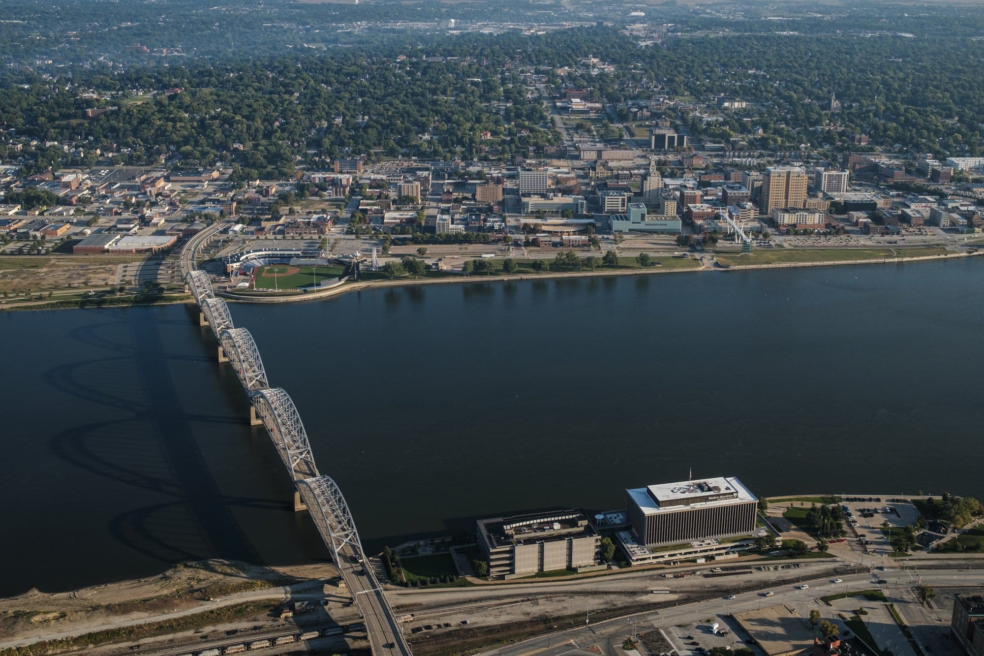 aerial view of a town, with a bridge across the water