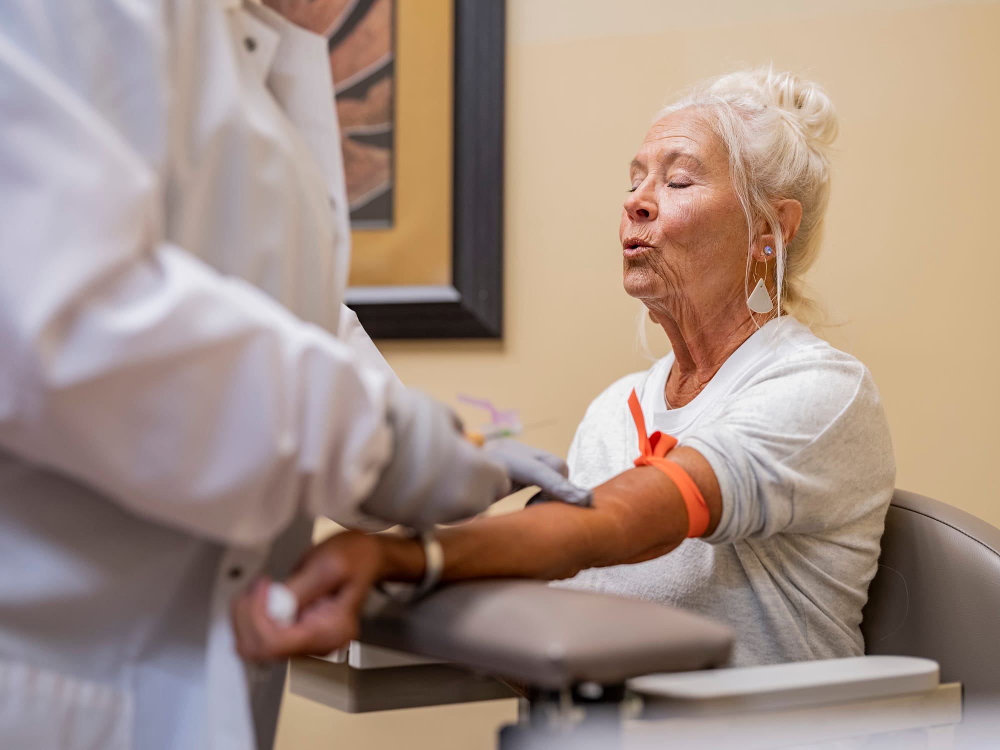 A woman receives a blood draw