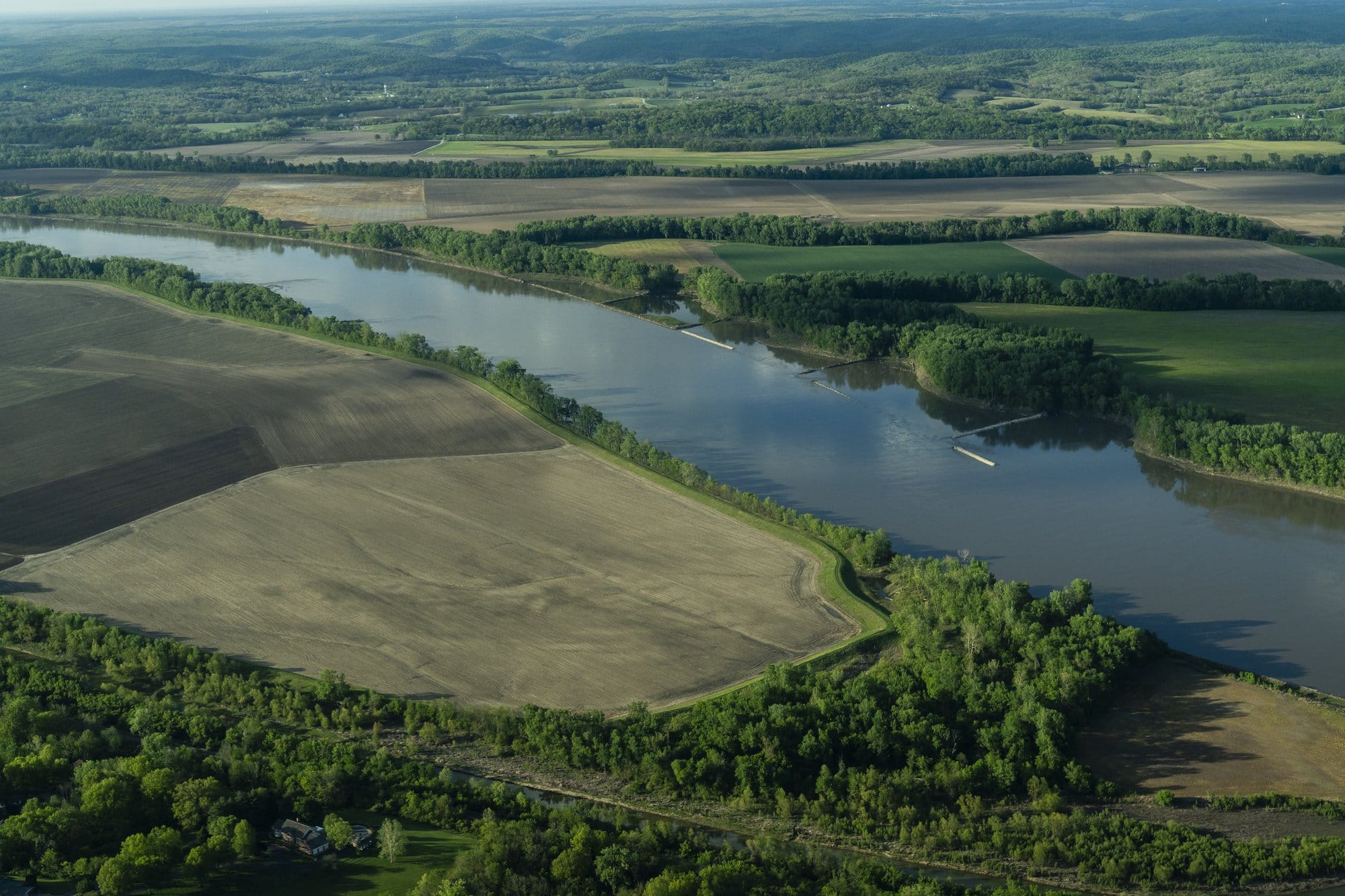 Fertilizer runoff from farmland, like these farms seen along the Mississippi River in Missouri on April 24, 2024, is a major
