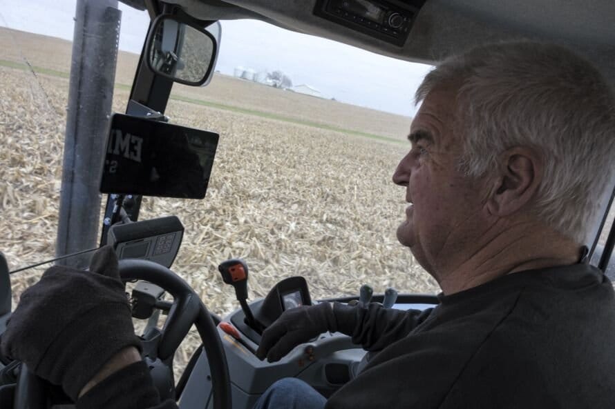 Farmer Dan Voss drives farm equipment through a field.