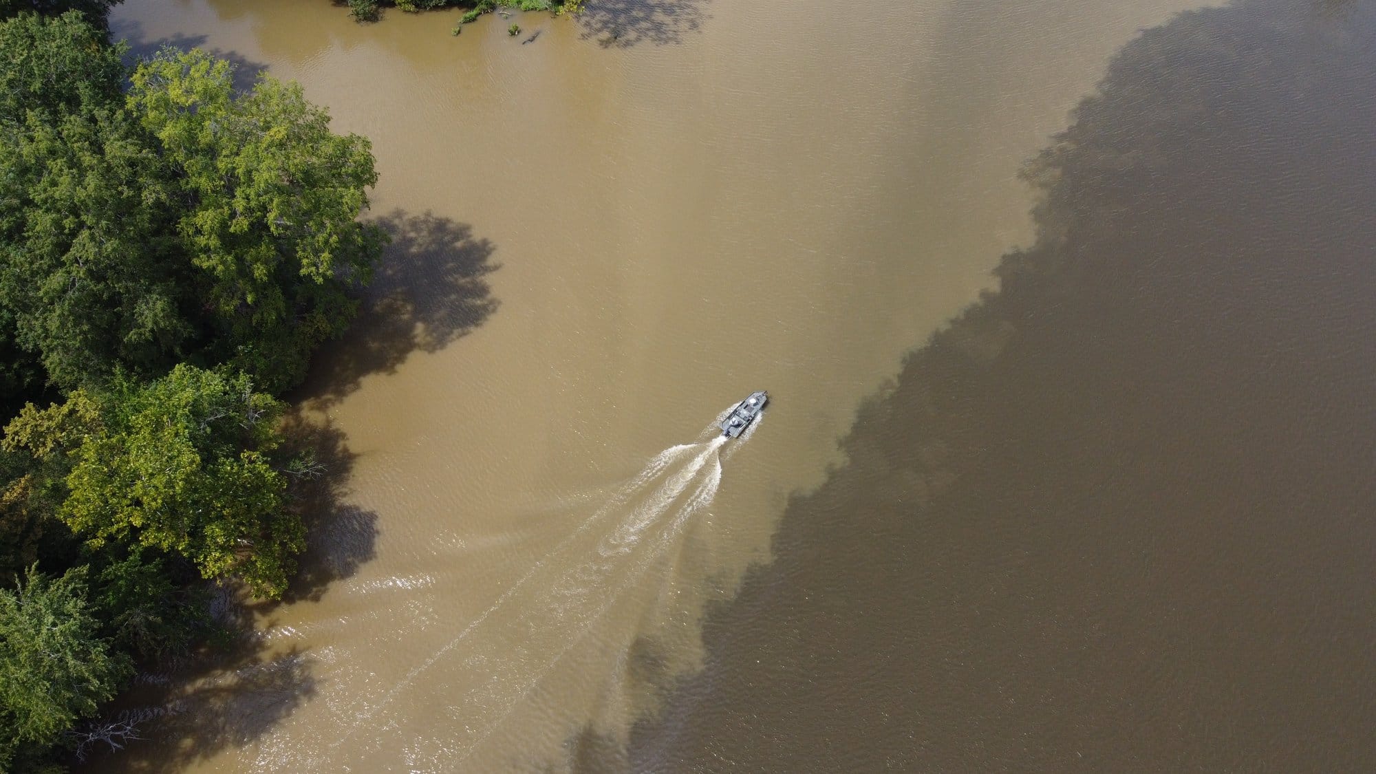Runoff creates a visible line in the Appomattox River, a major tributary of the James River, which flows into southern