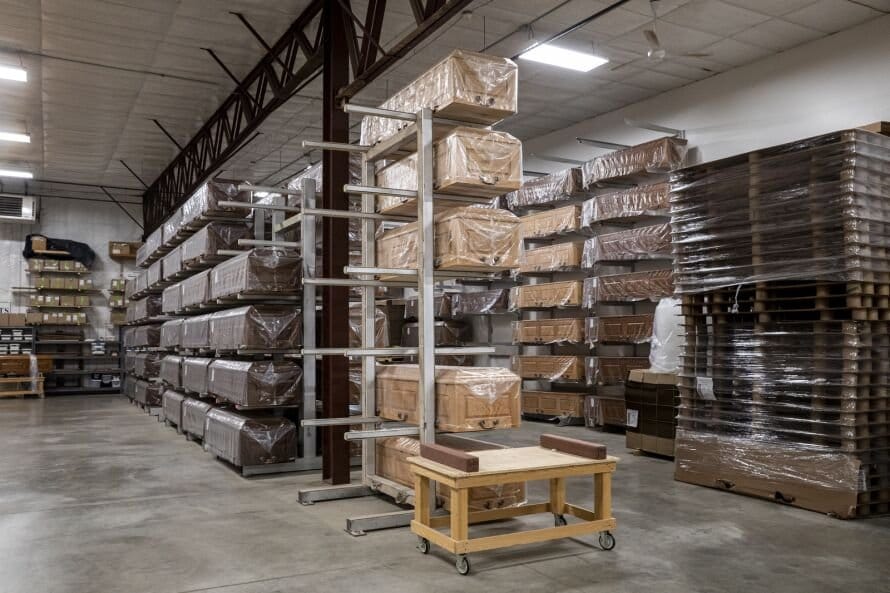 Completed caskets sit on racks