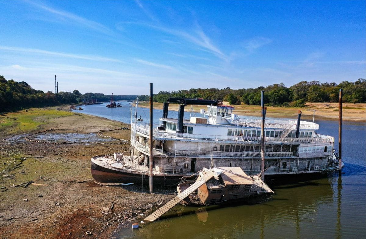 A riverboat is stuck on the river where water levels are low