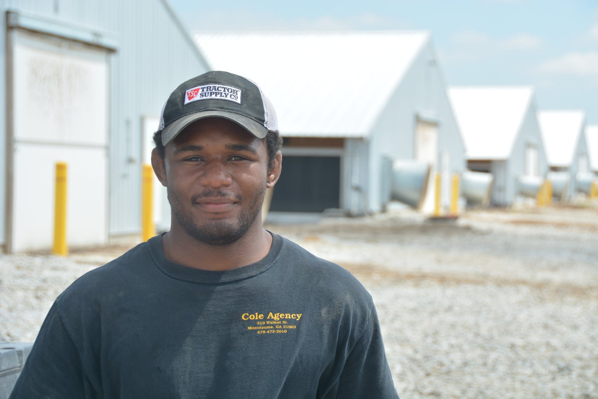 Zemua Baptista stands outside his chicken barns near Seward, Nebraska in 2020.