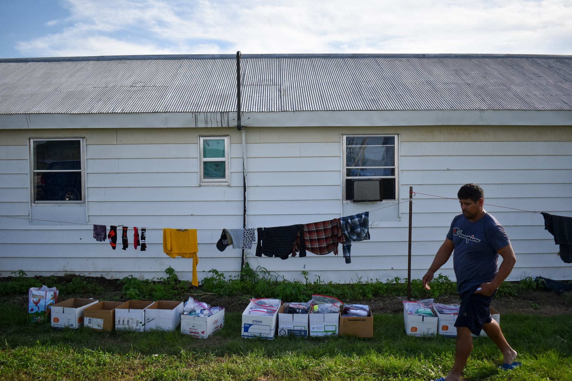 A man walks beside a laundry line