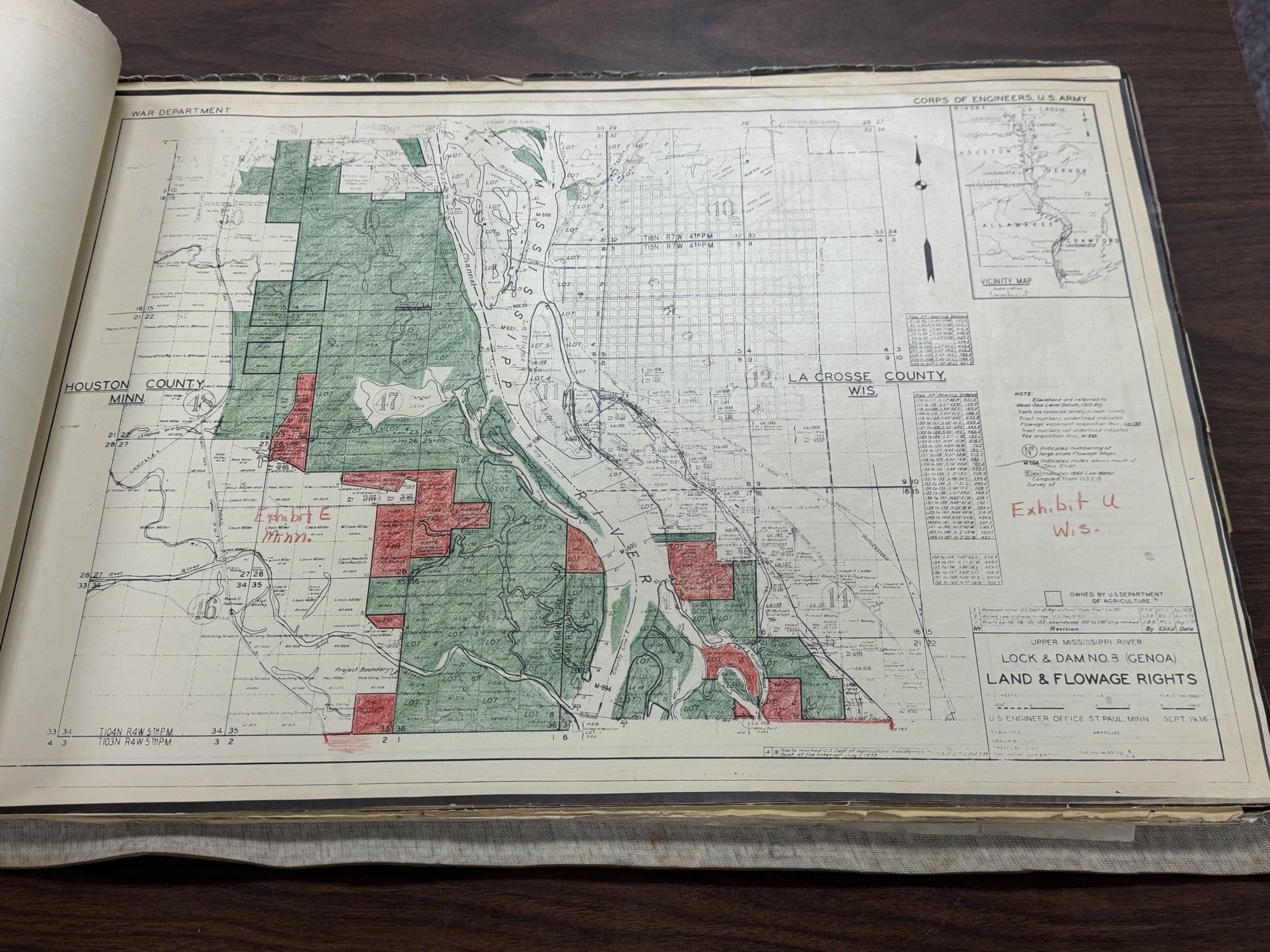 A page from a large antique book that shows land and flowage rights on a map