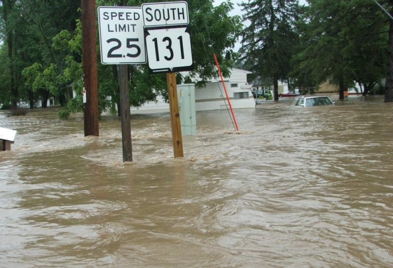 Floodwaters submerge street signs